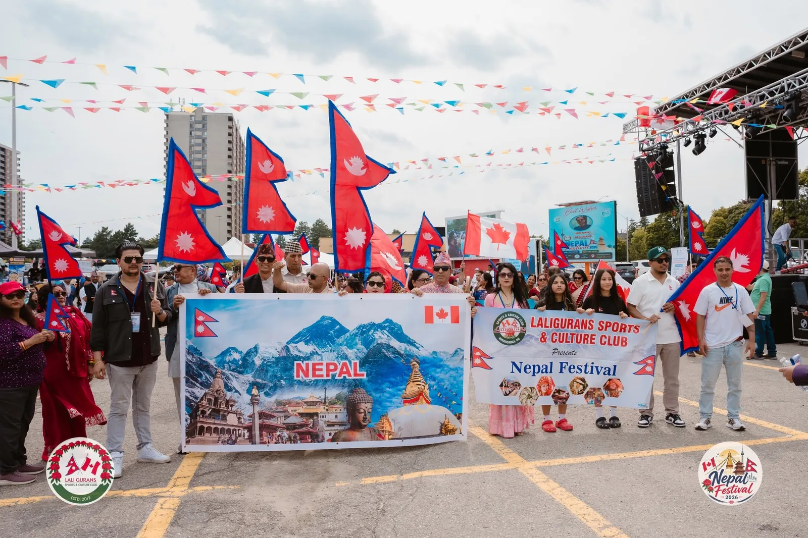 Community parade with Nepali and Canadian flags
